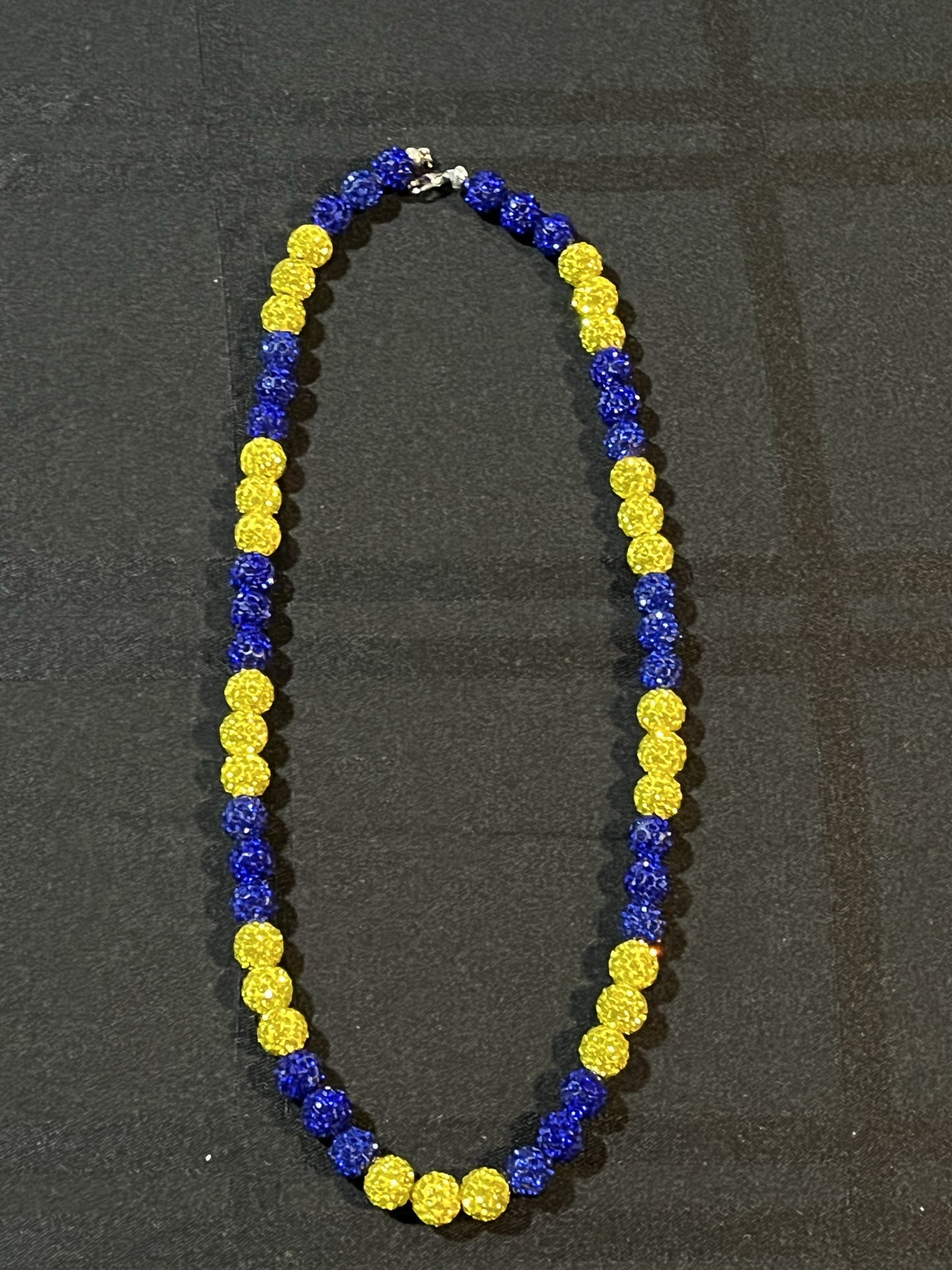 blue and yellow drip necklace