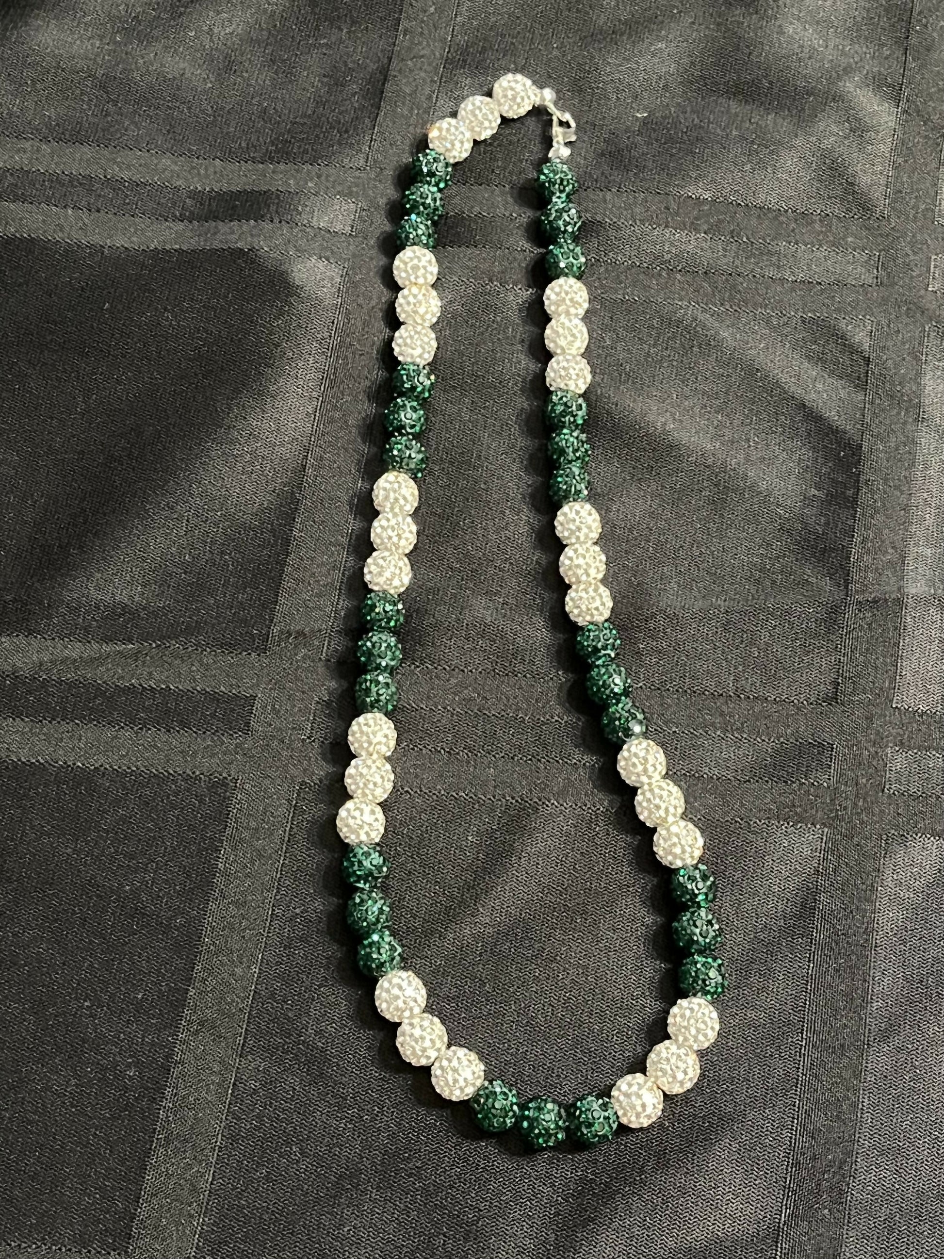 green and white beaded necklace