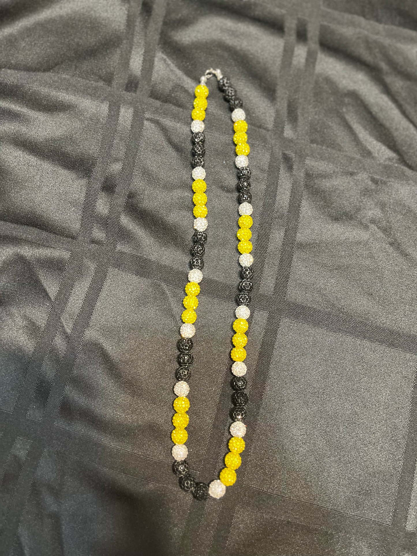 Black yellow and white beaded necklace